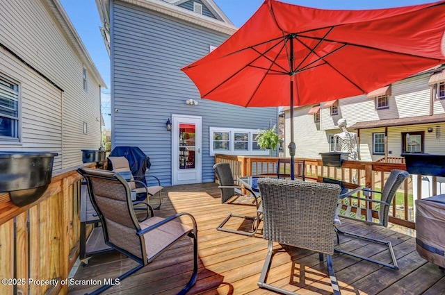 wooden deck with grilling area