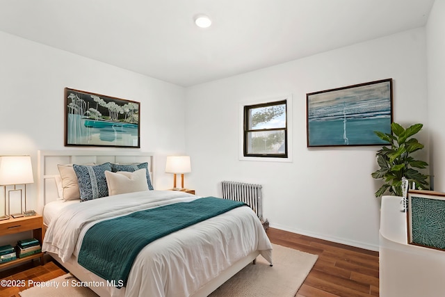 bedroom with baseboards, recessed lighting, dark wood finished floors, and radiator