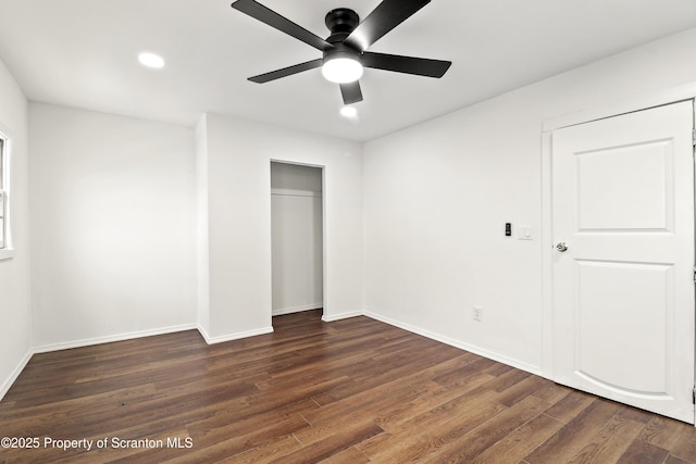 unfurnished bedroom featuring dark wood-style floors, a closet, recessed lighting, and baseboards