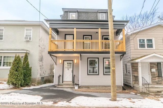 view of front of home with a balcony