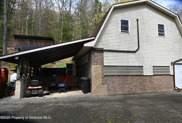 3511 Liberty Park Rd, Hallstead, PA 18822 - view of side of property with a gambrel roof and an attached carport