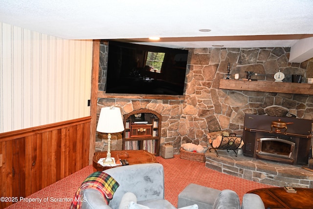 3511 Liberty Park Rd, Hallstead, PA 18822 - carpeted living area with wainscoting, a fireplace, and wood walls