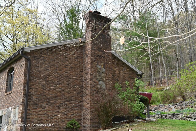 3511 Liberty Park Rd, Hallstead, PA 18822 - view of side of home with a chimney and brick siding