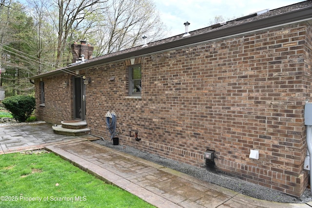 3511 Liberty Park Rd, Hallstead, PA 18822 - view of side of home with a chimney, crawl space, and brick siding