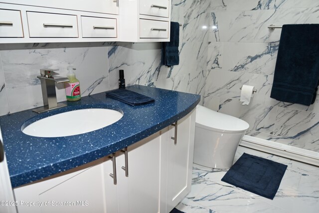 3511 Liberty Park Rd, Hallstead, PA 18822 - bathroom featuring vanity, marble tiled floors, tile walls, toilet, and backsplash