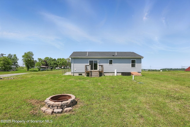 960 Lott Rd, Meshoppen, PA 18630 - back of house featuring a fire pit and a lawn