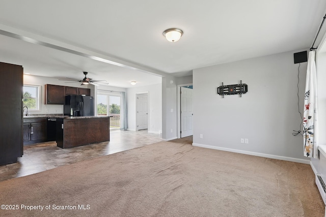 960 Lott Rd, Meshoppen, PA 18630 - unfurnished living room with light colored carpet, healthy amount of natural light, baseboards, and a sink