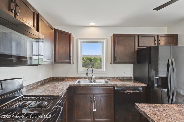 960 Lott Rd, Meshoppen, PA 18630 - kitchen with black appliances, a sink, dark countertops, dark brown cabinets, and recessed lighting