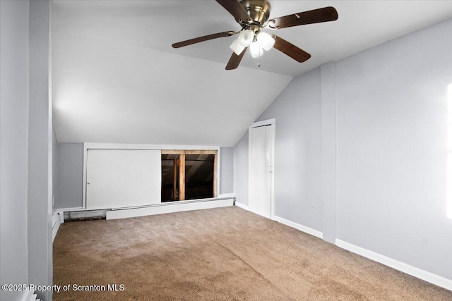 unfurnished room featuring vaulted ceiling and carpet flooring