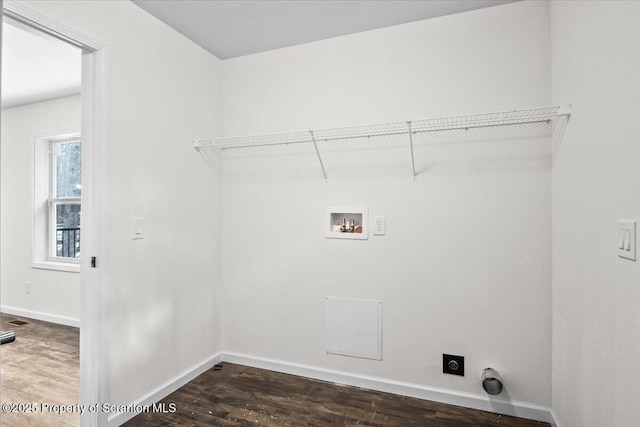 laundry room featuring hookup for a washing machine, dark hardwood / wood-style floors, and hookup for an electric dryer