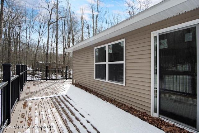 view of snow covered deck