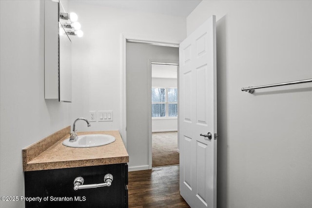 bathroom with hardwood / wood-style flooring and vanity