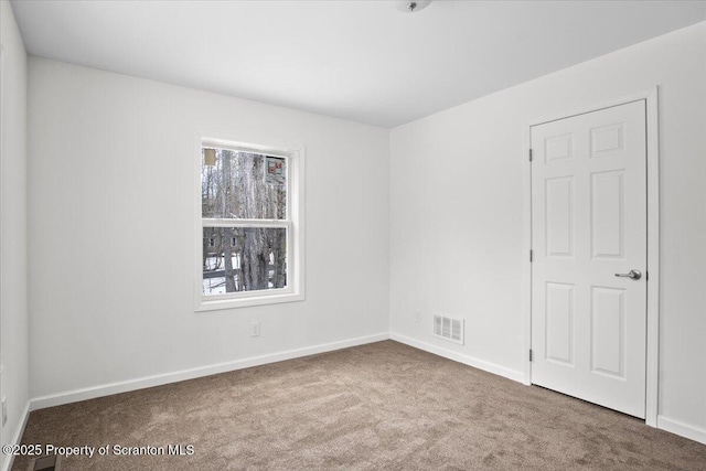 view of carpeted spare room