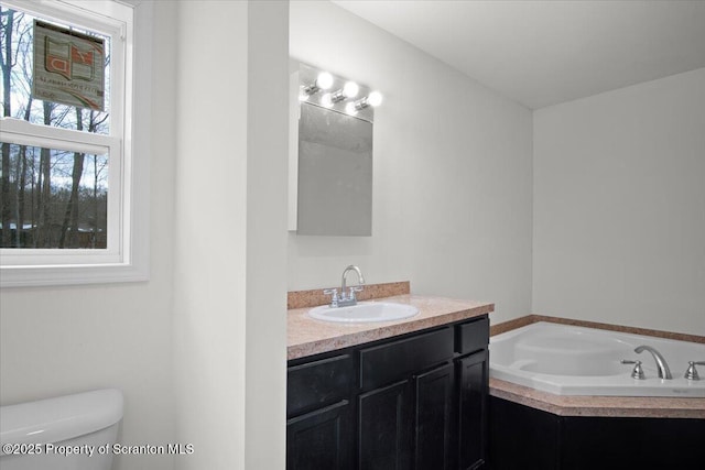 bathroom featuring vanity, toilet, and a bathtub