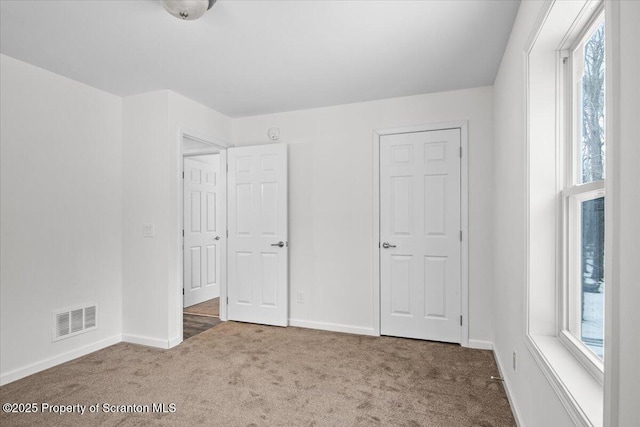 unfurnished bedroom featuring carpet flooring