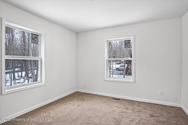 unfurnished room featuring carpet flooring