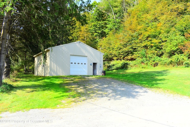 garage featuring a yard