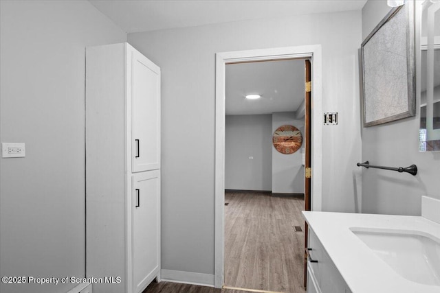 128 Franklin Ave Unit L 37-38, Greenfield Twp, PA 18407 - bathroom featuring baseboards, vanity, and wood finished floors