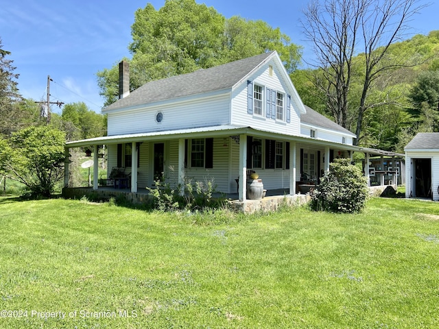 farmhouse inspired home featuring a front lawn and a porch