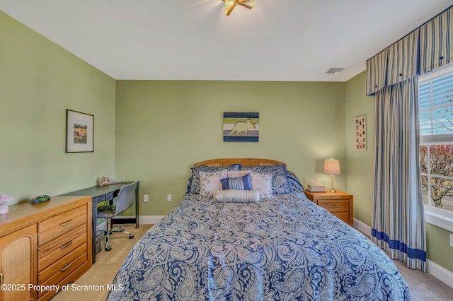 bedroom featuring light colored carpet, baseboards, and visible vents