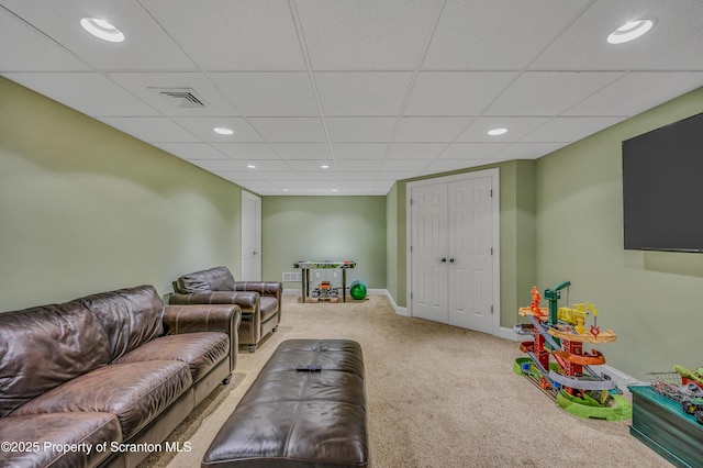 living area featuring baseboards, recessed lighting, and carpet