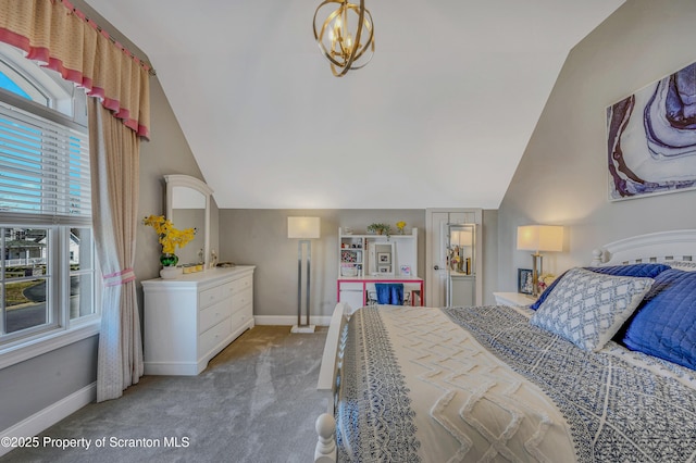 bedroom with baseboards, lofted ceiling, and carpet