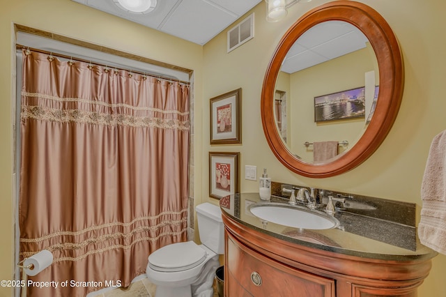 full bathroom featuring toilet, vanity, visible vents, and a shower with curtain
