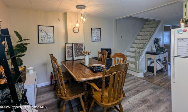 26-28 Glinko St, Scranton, PA 18504 - dining room featuring wood finished floors and stairway