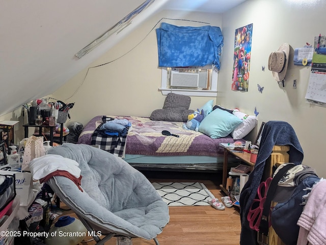 26-28 Glinko St, Scranton, PA 18504 - bedroom featuring wood finished floors, lofted ceiling, and cooling unit