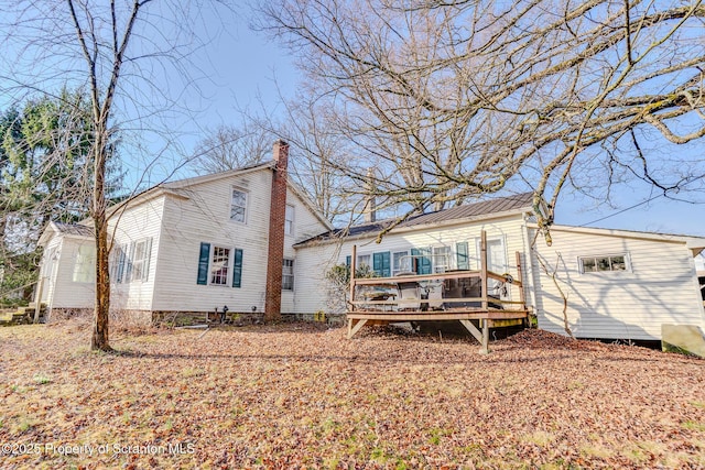 125 Tingley Lake Rd, Harford, PA 18823 - rear view of property with a chimney and a wooden deck