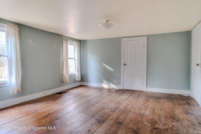 125 Tingley Lake Rd, Harford, PA 18823 - spare room featuring plenty of natural light, baseboards, visible vents, and hardwood / wood-style flooring