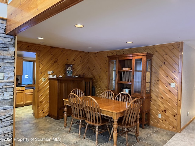 dining area with wood walls