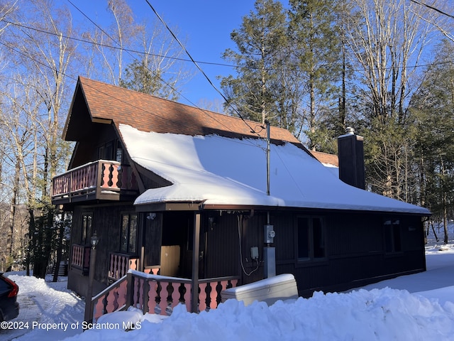 view of front of house featuring a porch and a balcony