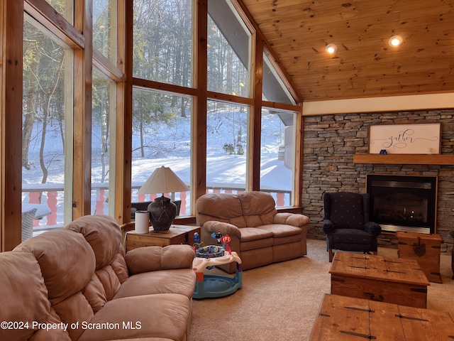 carpeted living room with a fireplace, high vaulted ceiling, a wall of windows, and wood ceiling