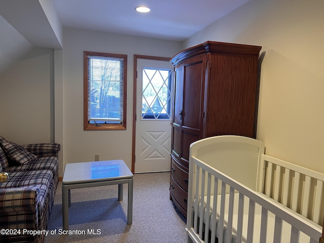 bedroom featuring light carpet