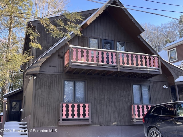 view of home's exterior featuring a balcony