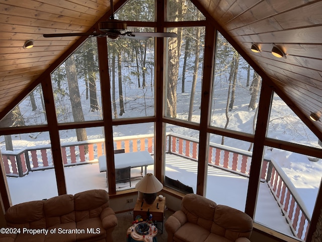 unfurnished sunroom featuring vaulted ceiling and wood ceiling