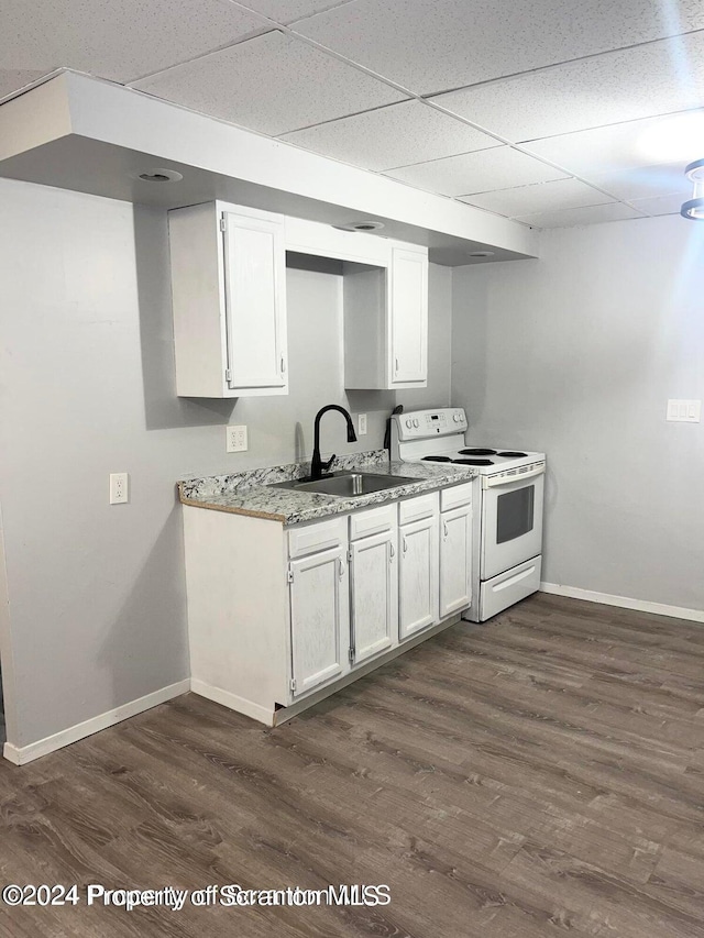 kitchen featuring white cabinetry, sink, white range with electric cooktop, dark wood-type flooring, and a drop ceiling