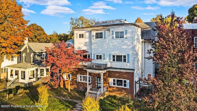 view of front of home with brick siding