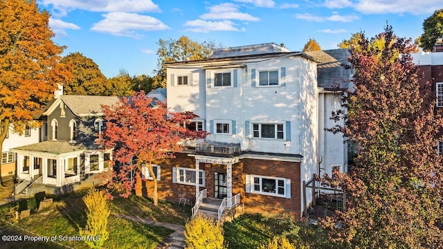 exterior space with brick siding