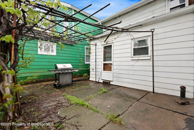 view of patio with a grill