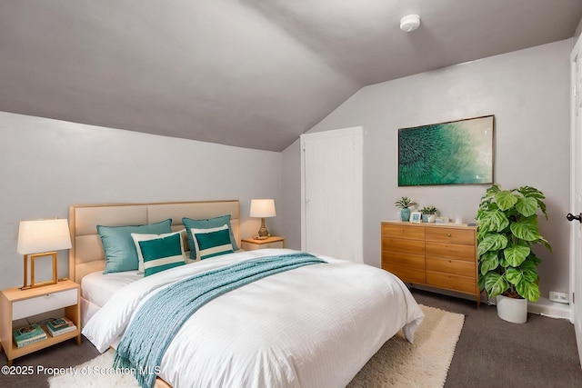 bedroom with carpet and lofted ceiling