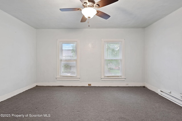 unfurnished room featuring healthy amount of natural light, carpet flooring, and baseboard heating