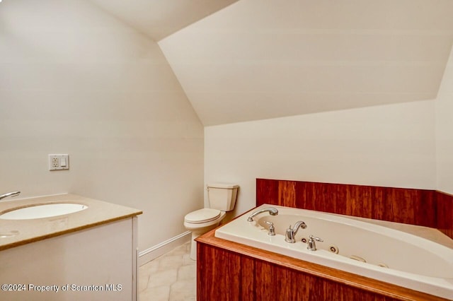 bathroom with a tub to relax in, vanity, vaulted ceiling, and toilet