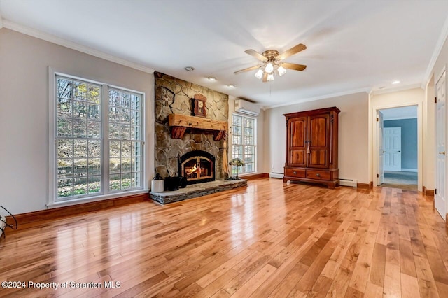 unfurnished living room featuring a wall mounted AC, crown molding, ceiling fan, light hardwood / wood-style flooring, and a fireplace