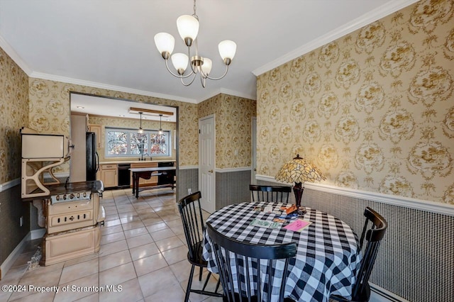 dining area with tile patterned flooring, an inviting chandelier, crown molding, and sink