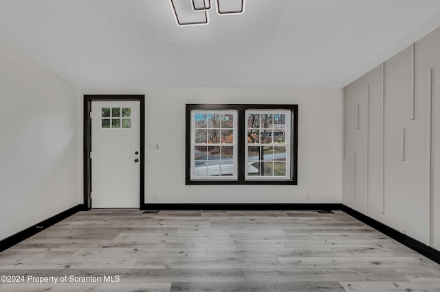 entrance to property featuring a wooden deck