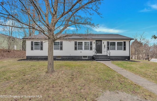 view of front of home with a front yard