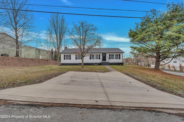 view of front of home with a patio area and a front lawn