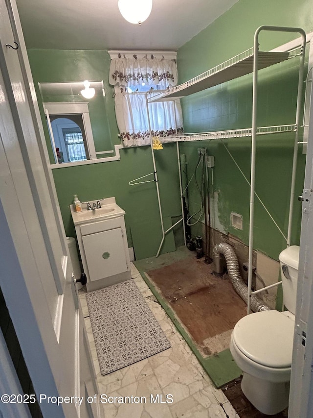 bathroom with toilet and vanity